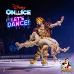 Disney On Ice "Let's Dance!" promotional image featuring Mickey, Minnie, Donald, and Goofy in colorful outfits with dancers on an illuminated stage. Text reads: Canada Life Centre, Nov 7–9.